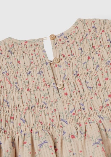  Kız Çocuk Ekru Gofre Kumaş Çiçek Desenli Lastikli Pileli Uzun Kollu Elbise