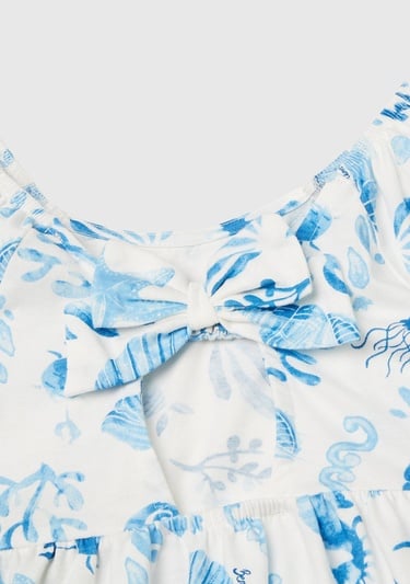  Kız Çocuk Mavi Desenli Önü Fiyonklu Kolları ve Eteği Pileli Elbise