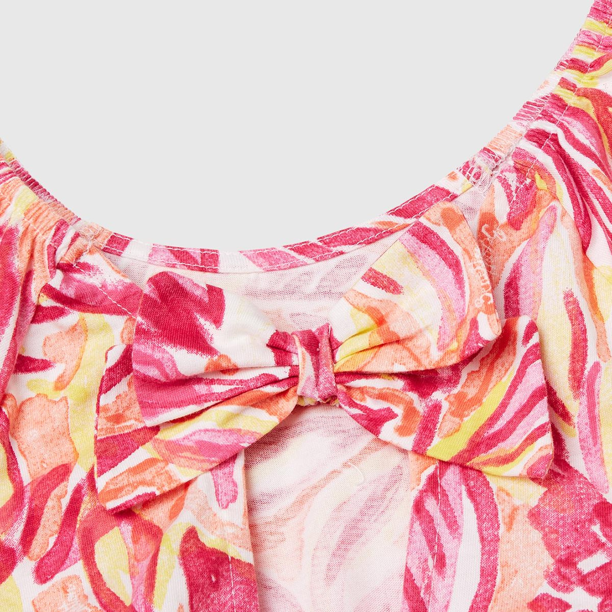 Kız Çocuk Turuncu Desenli Önü Fiyonklu Kolları ve Eteği Pileli Elbise