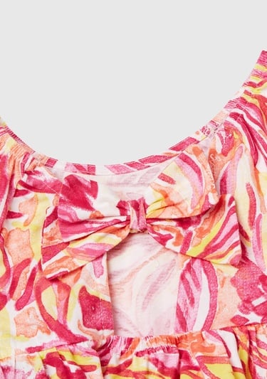  Kız Çocuk Turuncu Desenli Önü Fiyonklu Kolları ve Eteği Pileli Elbise