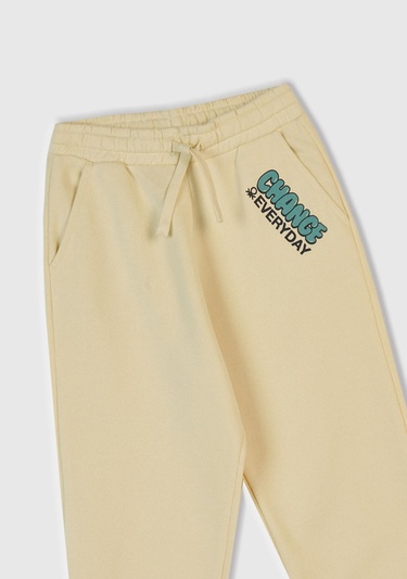  Erkek Çocuk Krem Baskılı Beli ve Bileği Lastikli İpli  Eşofman Altı